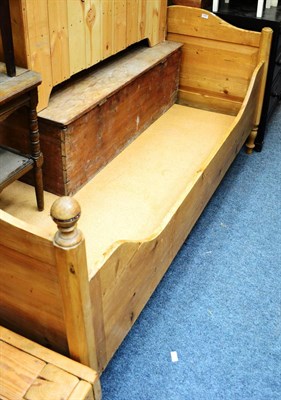 Lot 1043 - Pine single bed, a pine open bookcase and a cot