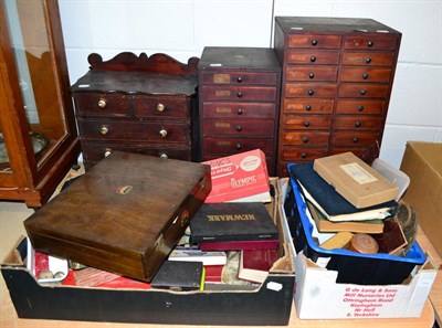 Lot 1062 - A quantity of clock and watch parts in three cabinets and two boxes