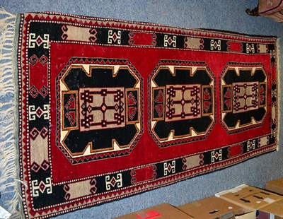 Lot 1085 - Pair of East Anatolia rugs, possibly Kars, each with three octagons enclosed by latch hook...