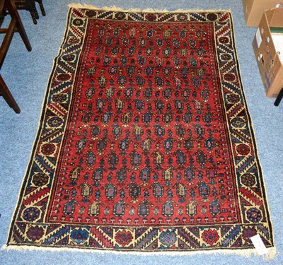 Lot 1112 - Unusual Hamadan rug, Persian Kurdistan, the field of polychrome boteh enclosed by stepped leaf...