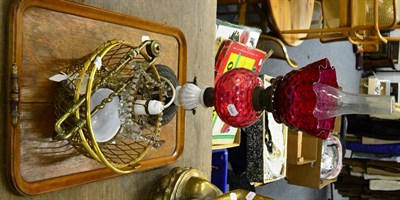 Lot 1152 - Cranberry oil lamp, oak tray, light fittings, etc