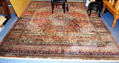 Lot 1154 - Machine-made ";Motashem Kashan"; carpet, Europe, the terracotta field of vines centred by an...