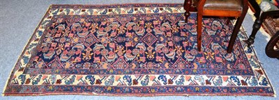 Lot 1155 - Hamadan rug, Persian Kurdistan, the deep indigo field of Herati design enclosed by ivory...