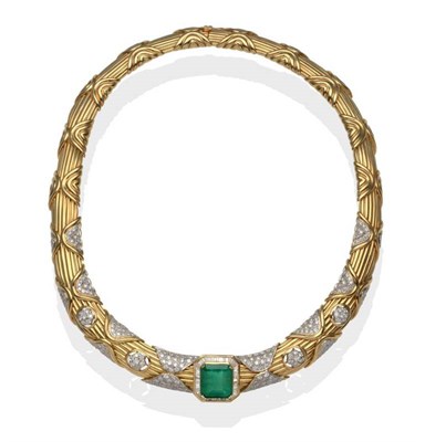 Lot 239 - An Emerald and Diamond Necklace, the emerald within a border of baguette cut diamonds, on a...