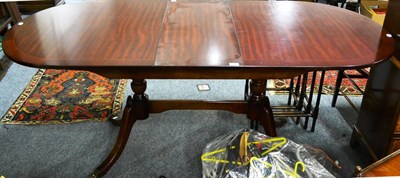 Lot 1186 - Strongbow twin pedestal extending dining table in mahogany veneer and a corner cupboard with glazed