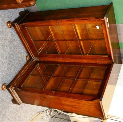 Lot 1190 - An oak glazed corner bookcase