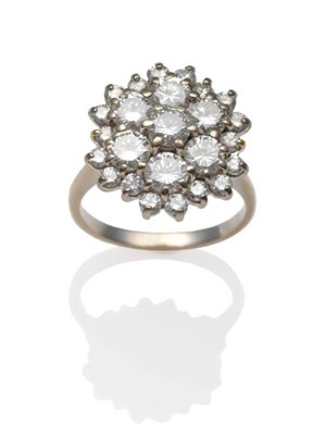 Lot 243 - A Diamond Cluster Ring, a central cluster of seven round brilliant cut diamonds within a border...