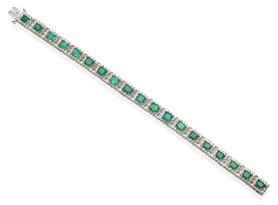 Lot 244 - An Emerald and Diamond Bracelet, emerald-cut emeralds within round brilliant cut diamond...