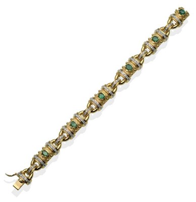 Lot 245 - An Emerald and Diamond Bracelet, with textured links each set with an oval cut emerald...