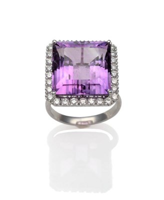 Lot 247 - An 18 Carat White Gold Amethyst and Diamond Ring, an emerald-cut amethyst in a white claw...