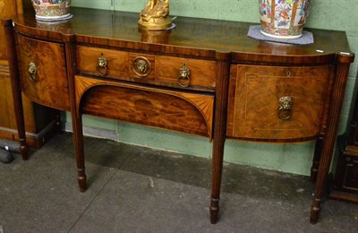 Lot 1283 - A George III style mahogany D section sideboard