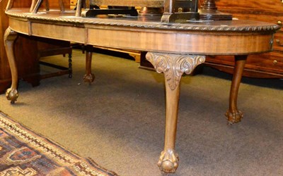 Lot 1306 - Mahogany extending dining table with gadrooned border, on ball and claw feet