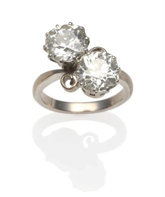 Lot 261 - A Diamond Two Stone Twist Ring, two old mine cut diamonds in white claw settings to scroll...