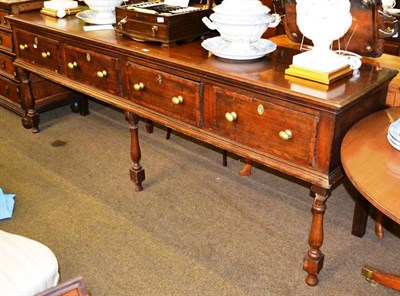 Lot 1346 - A 19th century oak dresser with four drawers