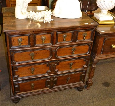 Lot 1347 - Late 17th century oak moulded chest of two short and three long drawers on bun feet (faded)