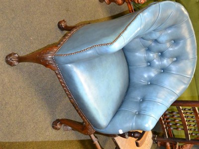 Lot 1355 - A mahogany framed blue leather-type button back tub chair