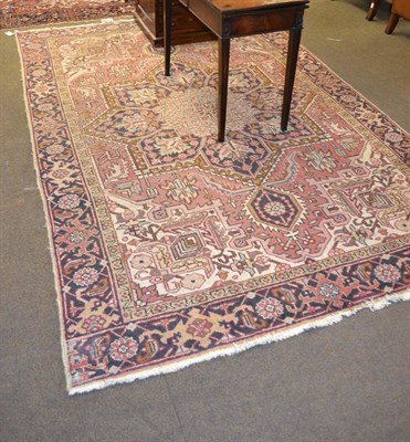 Lot 1386 - An Eastern pink ground patterned carpet with central foliate design within a border