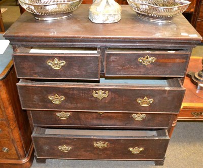 Lot 1389 - A 19th century oak chest of drawers