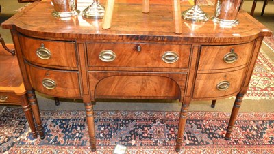 Lot 1394 - George IV mahogany break bow front sideboard with key