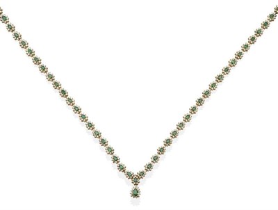 Lot 268 - An Emerald and Diamond Necklace, comprising clusters of pear cut emeralds within borders of...
