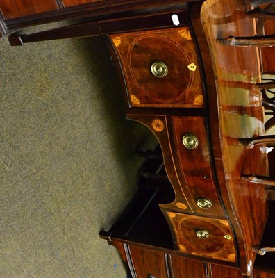 Lot 1403 - A George III mahogany serpentine shaped sideboard