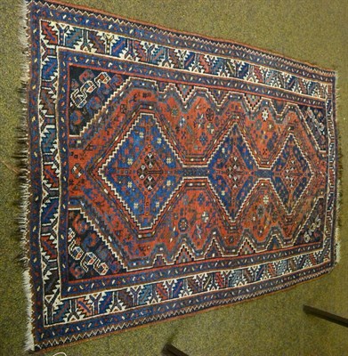 Lot 1442 - Khamseh rug, South West Persia, the terracotta field with three stepped medallions framed by...