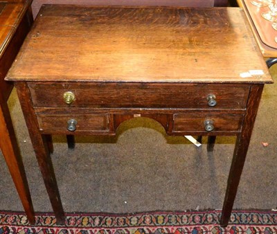 Lot 1443 - A 19th century oak lowboy