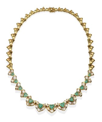 Lot 276 - An Emerald and Diamond Necklace, heart shaped emeralds part bordered by tapered baguette cut...