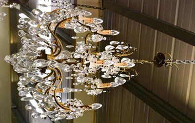 Lot 1455 - A ten branch gilt metal chandelier with cut glass drops  (ex Trawsgoed Mansion)