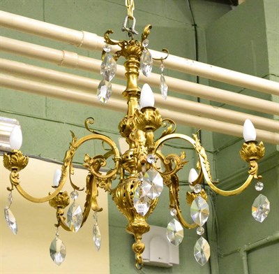 Lot 1460 - Late Victorian gilt brass electrolier for five lights hung with glass drops