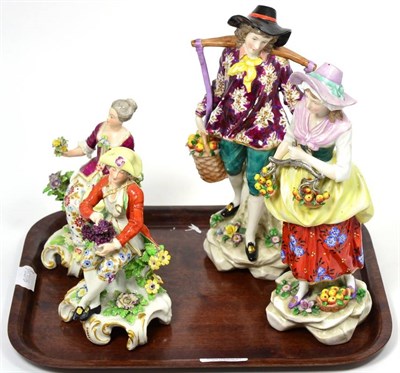 Lot 126 - A pair of porcelain figures of apple sellers, gold anchor marks; and a smaller pair of seated...
