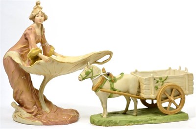 Lot 127 - Royal Dux figure of a maiden on a lily pad, and another of a horse and cart (2)