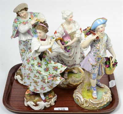 Lot 128 - A pair of Continental porcelain figures of grape pickers, pseudo Meissen marks; and a pair of...