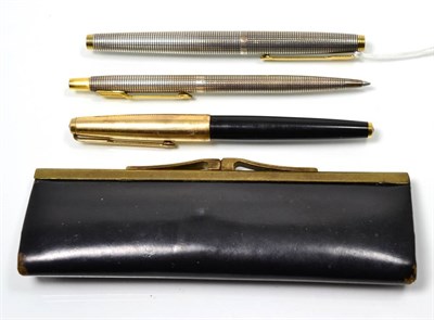 Lot 154 - A Parker Sterling silver fountain pen and a ballpoint pen; with another Parker fountain pen (3)