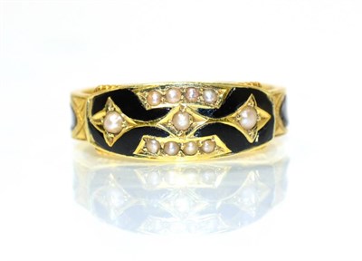 Lot 160 - An 18 carat gold mourning ring, bands of seed pearls within black enamel, on a chased and black...