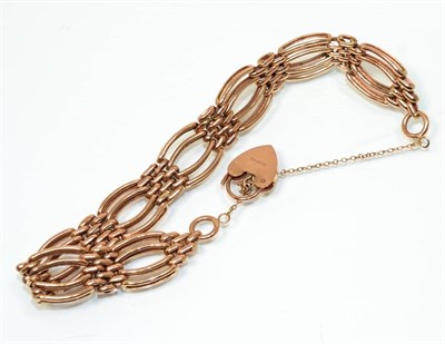 Lot 167 - A fancy gate link bracelet, with a 9 carat gold padlock clasp, length 19cm