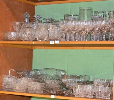 Lot 179 - A large quantity of assorted cut table glass, including Stuart; vases; bowls etc (on three shelves)