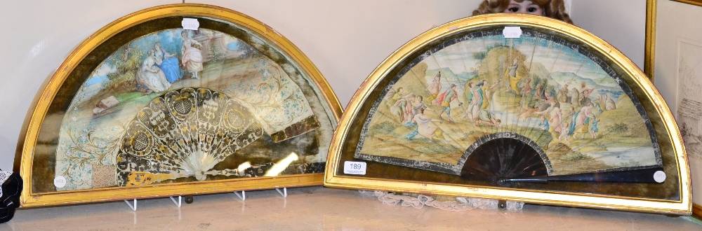 Lot 189 - A 19th century fan on mother of pearl pierced and painted sticks and guards, depicting figures...