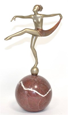 Lot 213 - An Art Deco patinated spelter figure, on a marble ball base, 23cm