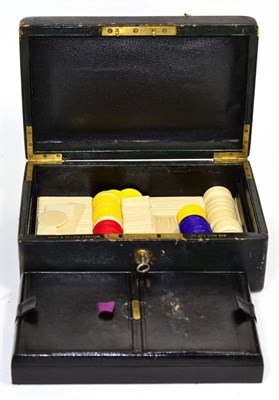 Lot 223 - Black leatherette games box including early 20th century ivory counters in the bottom