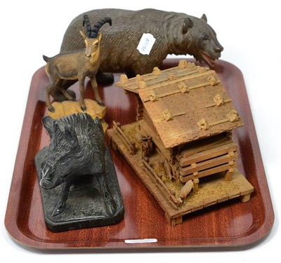 Lot 236 - Three Black Forest carved wood items comprising Ibex, Bear and Cottage; together with a stone...