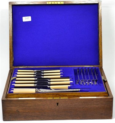 Lot 242 - An oak cased silverplated part canteen of cutlery, by the Goldsmiths & Silversmiths Co.