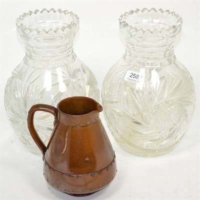 Lot 258 - A large pair of cut glass vases; and a Royal Doulton simulated copper jug