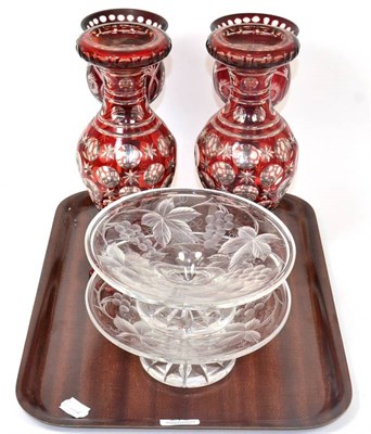 Lot 270 - A pair of ruby flashed and cut glass vases; a further pair of ruby flashed candle holders; and...