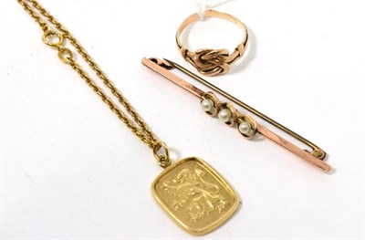 Lot 276 - A 9 carat gold rampant lion pendant on chain, measures 2cm by 1.5cm, chain length 45cm; a...