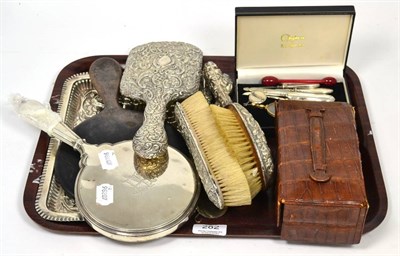 Lot 282 - A silver dressing table tray, a group of silver backed dressing table items; a leather...