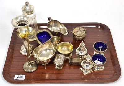 Lot 286 - A silver sauceboat, Walker & Hall; a four piece condiment set; various further condiments; a...