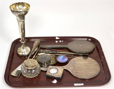 Lot 289 - Two silver dressing table hand mirrors; a silver repousse pin tray, Comyns; various button hooks; a