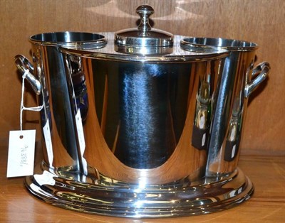 Lot 307 - A silver plated oval two bottle wine cooler with lid