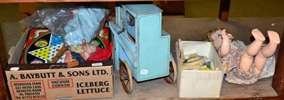 Lot 1029 - Vintage toys comprising: a model street organ; doll's house with contents; push along dog;...